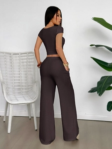 Side view of elegant dark brown short sleeve knit top and wide leg pants set