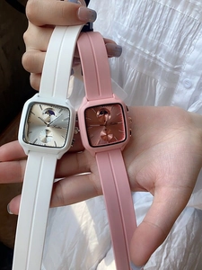 Close-up of white and pink silicone strap watches with square multifunctional dials