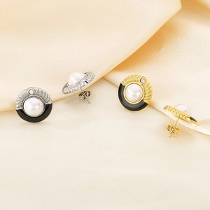 French palace style pearl earrings with black enamel inlay in gold and silver finish