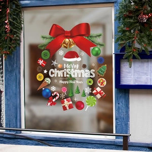 Festive Merry Christmas wreath window sticker with red bow, bells and holiday ornaments