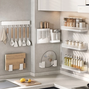 White wall-mounted kitchen organizer set with knife holder, spice rack and pot lid stand