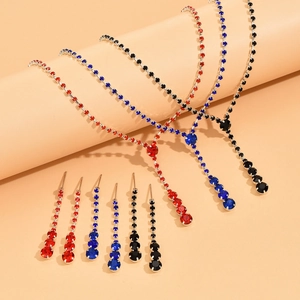 Macro shot of y-shaped rhinestone wedding necklace and drop earrings in three colors