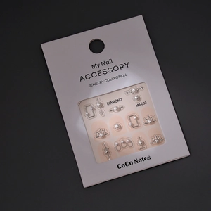 DIY nail art charms kit with silver geometric metal shapes and pearl accents for manicure