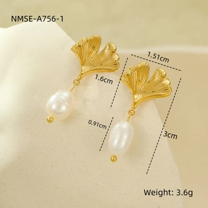 Detailed view of 18K gold ginkgo leaf earrings with freshwater pearl sizing measurements