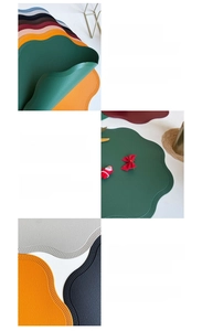 Detail of scalloped edge faux leather placemat with heat-pressed sealing and soft texture