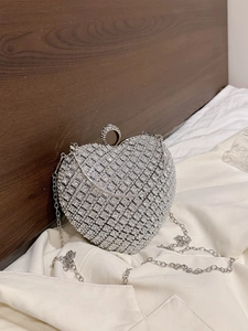 Sparkling silver rhinestone heart-shaped evening clutch bag with elegant chain strap