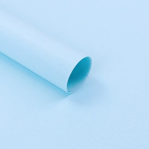Detail of premium blue tissue paper roll for floral bouquet and gift wrapping 50x70cm