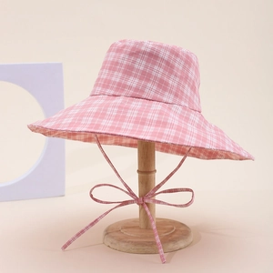Pink and white checkered bucket sun hat with wide brim and elegant chin strap ribbon