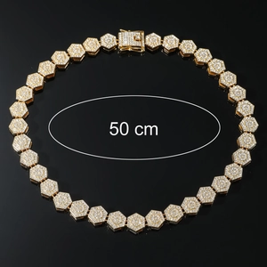 Detailed view of a 50 cm golden hip hop iced out necklace with geometric diamond links
