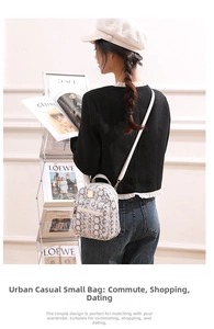 Detail of urban casual mini backpack featuring a light snakeskin texture and gold zipper
