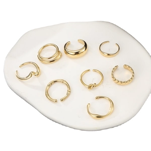 8-piece set of minimalist gold stainless steel rings and ear cuffs with textured patterns