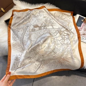 Silk square scarf with mythical carriage print in ivory and orange on faux fur rug