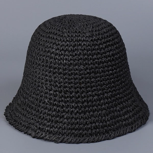Close-up of the intricate texture on a black hand-woven bucket hat for women