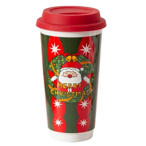 Green Christmas ceramic travel mug with red lid featuring Santa Claus and floral wreath