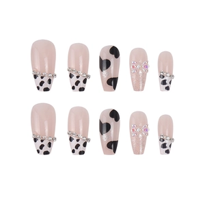 French leopard bow press-on nails with cow print, rhinestones, and long ballet shape