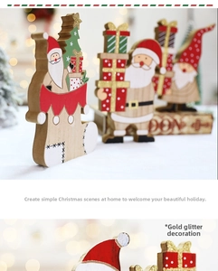 Detail of wooden Christmas decoration featuring Santa Claus and tree with glitter finish