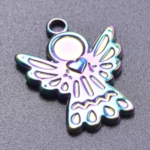Macro shot of an iridescent stainless steel angel pendant with a hollow heart detail