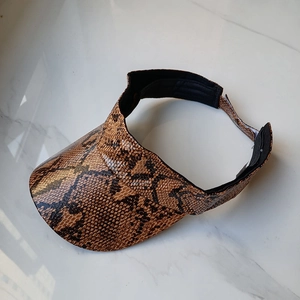 Detail of python print PU leather sun visor with adjustable black velcro closure