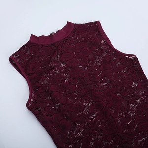 Detail of burgundy lace embroidery and sleeveless design on a slim-fit evening dress