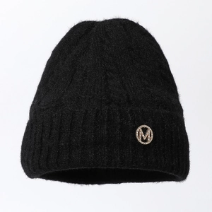 Classic black knitted beanie with a gold M rhinestone emblem for winter warmth