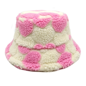 Pink and cream lamb wool bucket hat with heart pattern for winter warmth