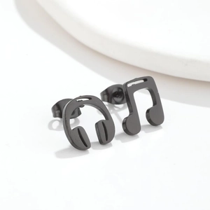 Minimalist black stainless steel music note and headphone stud earrings on white background