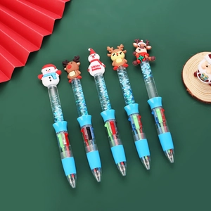 Detail of Christmas multi-color ballpoint pens with liquid glitter and 3D character toppers