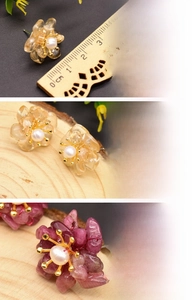 Detailed macro view of floral earrings with natural freshwater pearls and gold plating