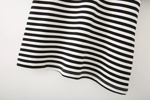 Detail shot of the hemline stitching and classic black and white striped cotton fabric