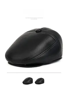 Detailed view of black faux leather texture and stitching on men winter newsboy cap