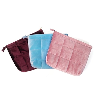 Velvet drawstring storage bags with diamond quilting in burgundy, blue and pink
