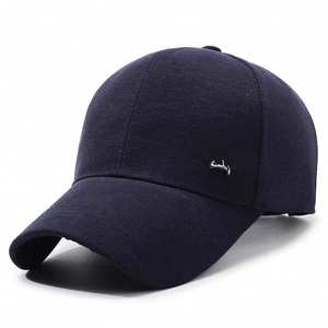 Navy blue minimalist baseball cap with silver metal trim and textured fabric