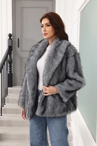 Detailed close-up of high-quality grey faux fur coat texture with waist belt and lapel