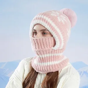 Pink and white knit balaclava hat with faux fur pompom for winter outdoor warmth