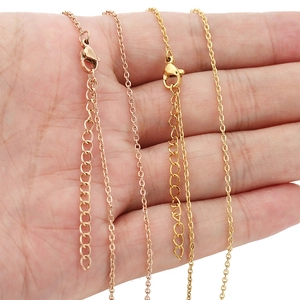 Classic 18k gold and rose gold stainless steel O-chain necklace held in hand