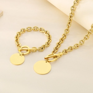 Detail of gold stainless steel OT buckle chain set with polished round pendant