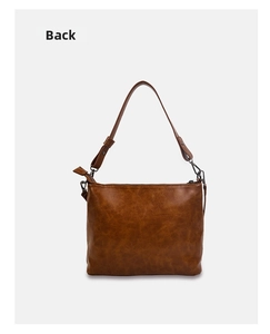 Detailed back view of a vintage brown leather tote bag with a smooth oiled finish