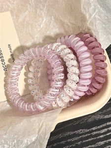 Detail view of colorful spiral hair ties set, cute telephone cord hair bands for daily cute hairstyles.
