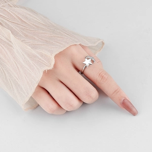 Elegant S925 sterling silver spinning star and moon open ring on a female finger
