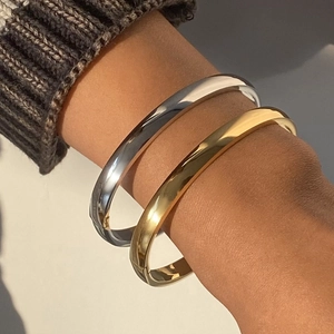 Polished stainless steel bangle bracelet set in gold and silver finish for women