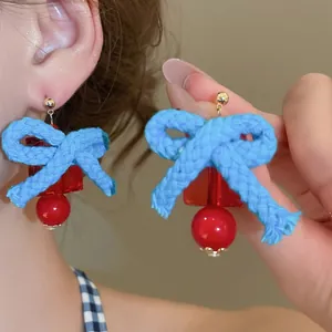 Klein blue resin earrings with red bow and tassel, retro vintage style for women