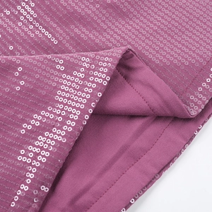 Macro detail of purple sequin dress showing fine stitching and shimmering striped fabric