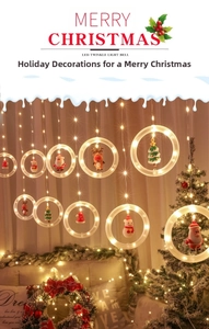 Detail of warm white LED Christmas ring lights with festive miniature figurines inside