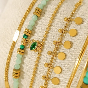 Bohemian gold layered bracelet with green natural stone beads and evil eye pendant