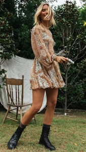 Bohemian floral smocked mini dress with long sleeves and ruffled hem in brown and white
