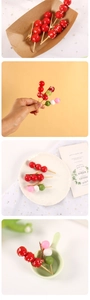 Macro view of realistic candied hawthorn and dango food clips with metal alligator grip