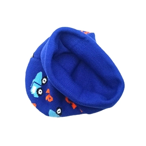 Blue knitted children's winter hat with cartoon excavator patterns and warm ear flaps