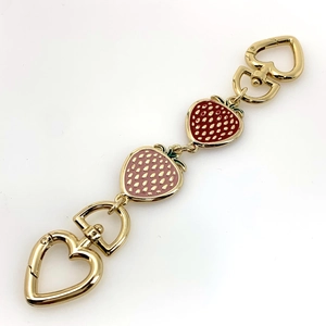 Golden handbag chain strap with strawberry heart charms and secure lobster clasps