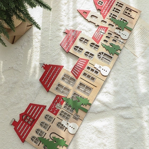 European style wooden Christmas fence ornament featuring red houses and white snowmen