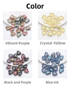 Detail view of heart-shaped glass pendants in purple, pink, black, and blue colors